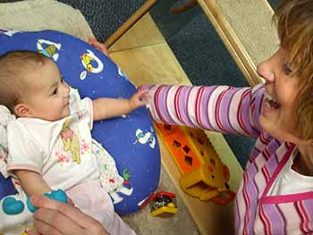Caregiver interacting with infant