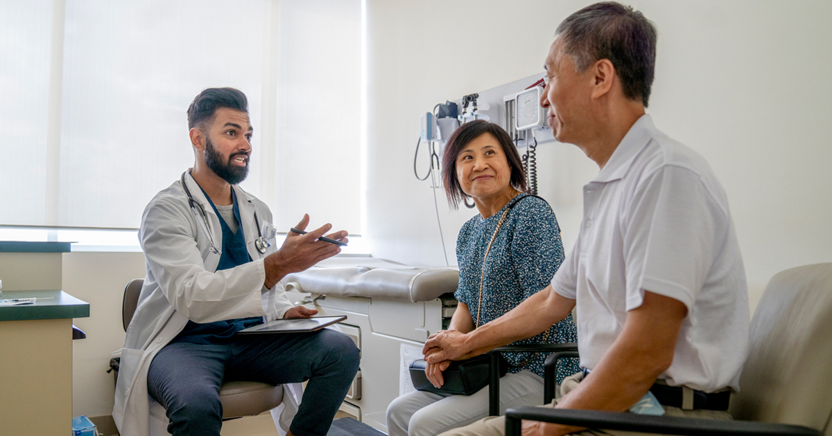 Doctor talking with patients about their health care